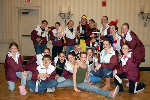 Northstar Dance Academy students posing with awards and smiles